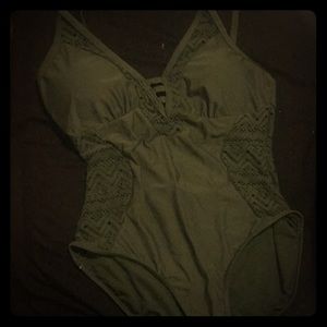 A dark green swimsuit (one piece )